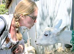 Lauren interacting with local goat